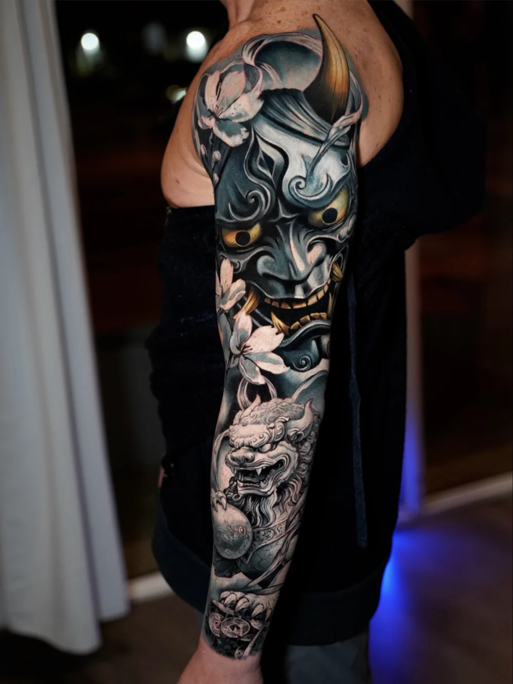 Japanese sleeve cover-up with a Hannya mask, guardian lion and cherry blossoms