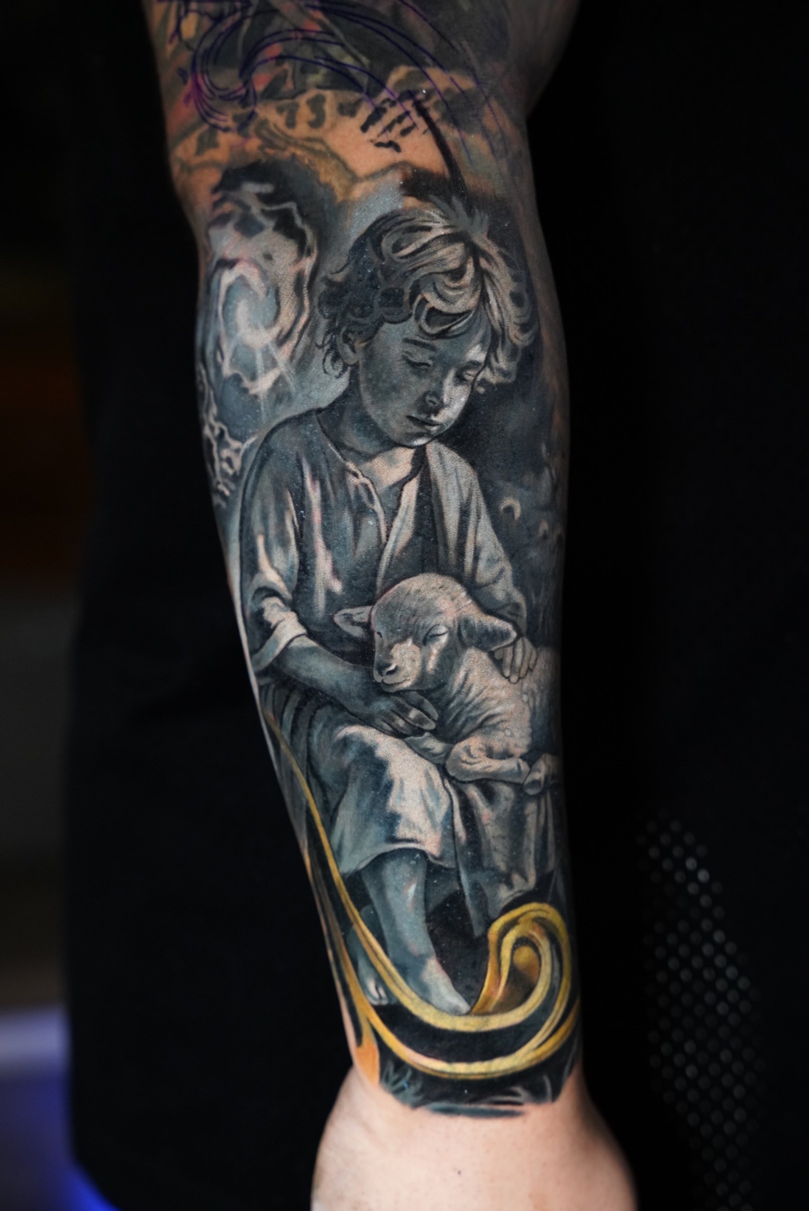 Emotional realism cover-up detail depicting innocence and protection. Soft textures, sculptural shading, and subtle contrast used to create depth and harmony within a large-scale sleeve composition.