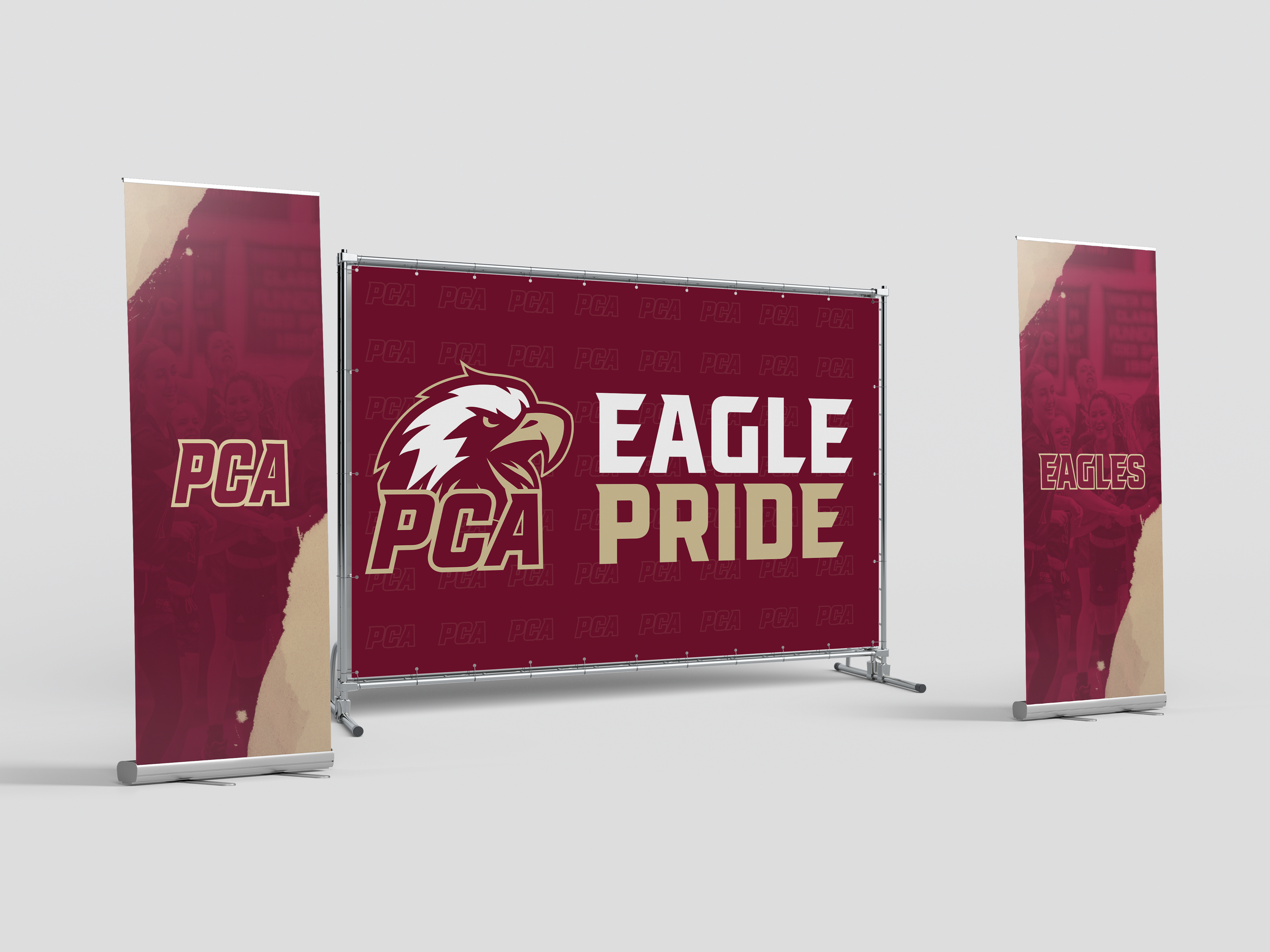 Display banners and a backdrop with PCA Eagles logo and the words "Eagle Pride" in maroon, white, and gold colors.