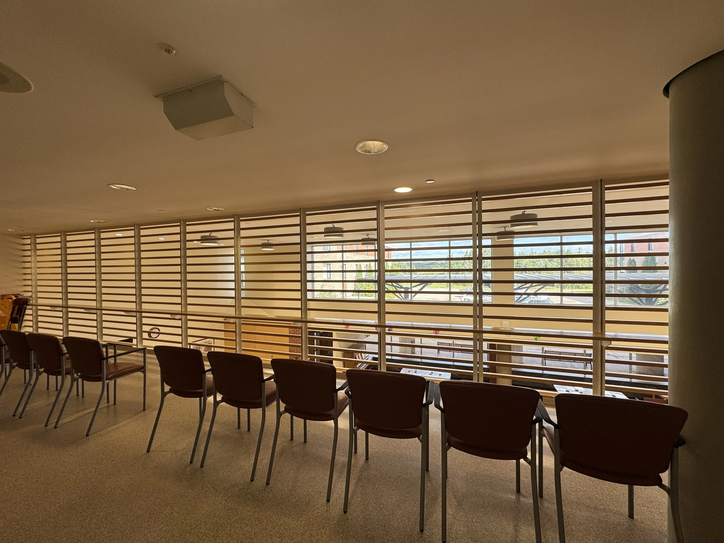 The second-floor balcony is a lovely space where residents can sit, relax, and listen to music or watch entertainment happening below. It provides a comfortable spot to enjoy activities and special events from above while spending time with friends a