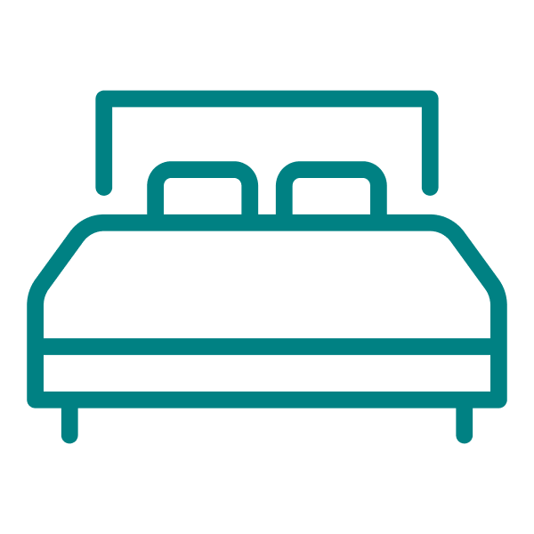 Line drawing of a bed with two pillows and a headboard.