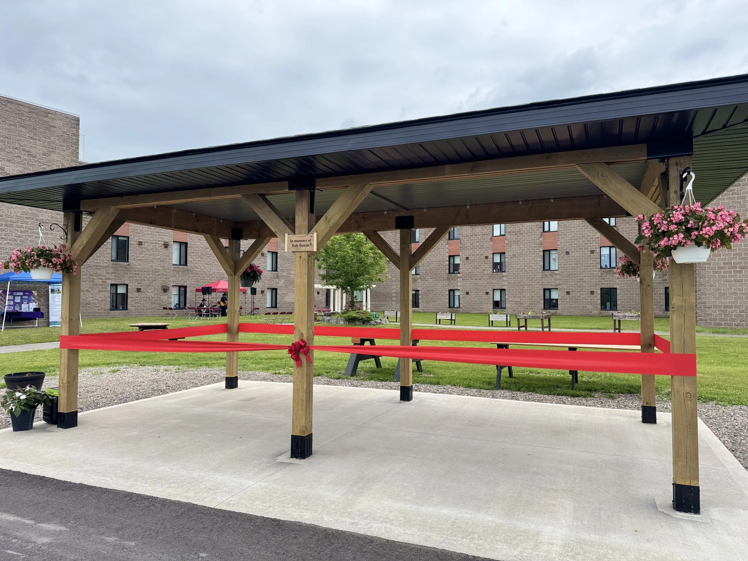 Garden Gazebo: A beautiful outdoor space with tables and benches where residents can sit, enjoy the fresh air, have lunch, and spend quality time with family, friends, and staff.