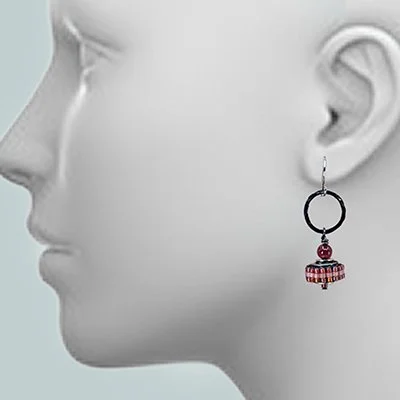 Close-up profile of a mannequin's head wearing a black and red beaded drop earring.