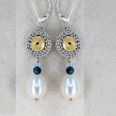 Silver earrings with gold and diamond-like circular designs, blue gemstones, and white pearl drops.