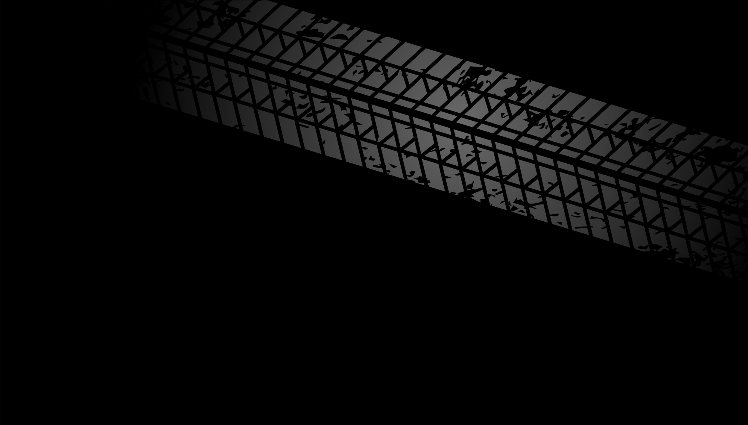 A dark shadow of tire marks.