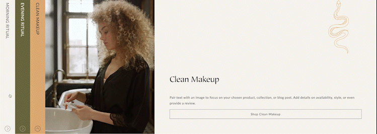 A woman with curly blonde hair examining a makeup brush in a brightly lit room with a window and black sink.
