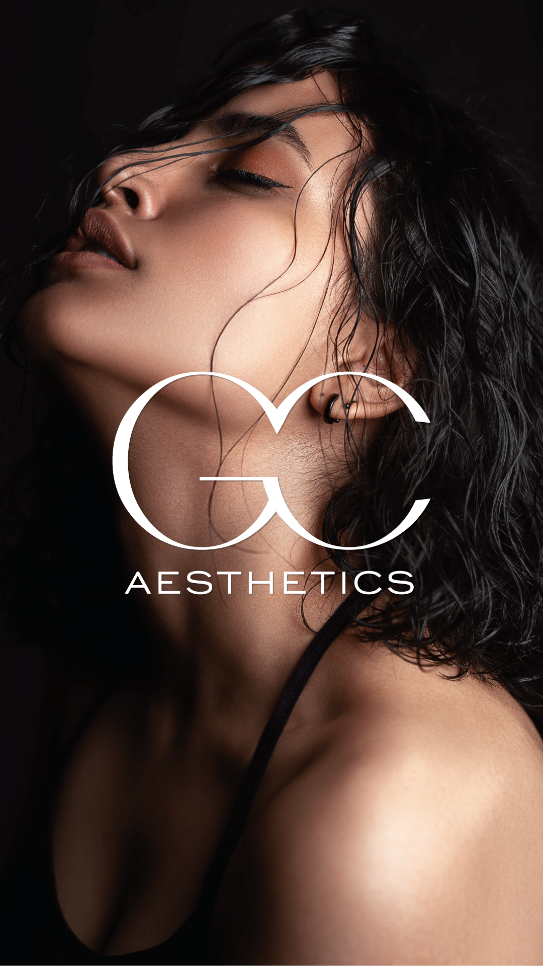 Close-up of a woman with dark, wavy hair and makeup, with a logo for CC Aesthetics overlaid on her face.