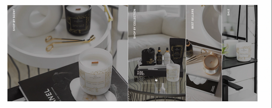 Display of candles, perfume, and skincare products in a modern, minimalist setting with a white sofa and decorative items.