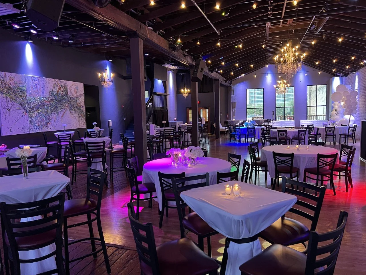 Wedding reception setup with round tables and white linens at Twenty Seven venue in downtown Little Rock Arkansas