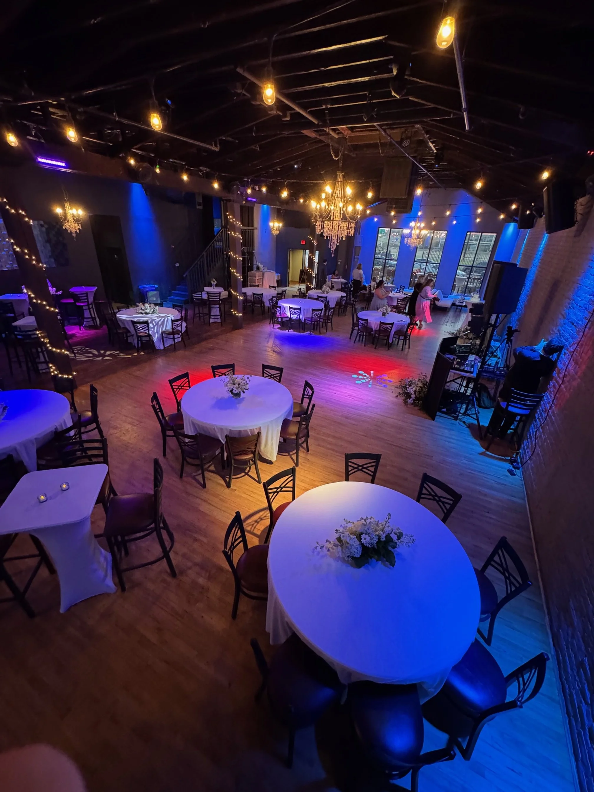 Round tables for a wedding reception setup at Twenty Seven Event Venue in Little Rock