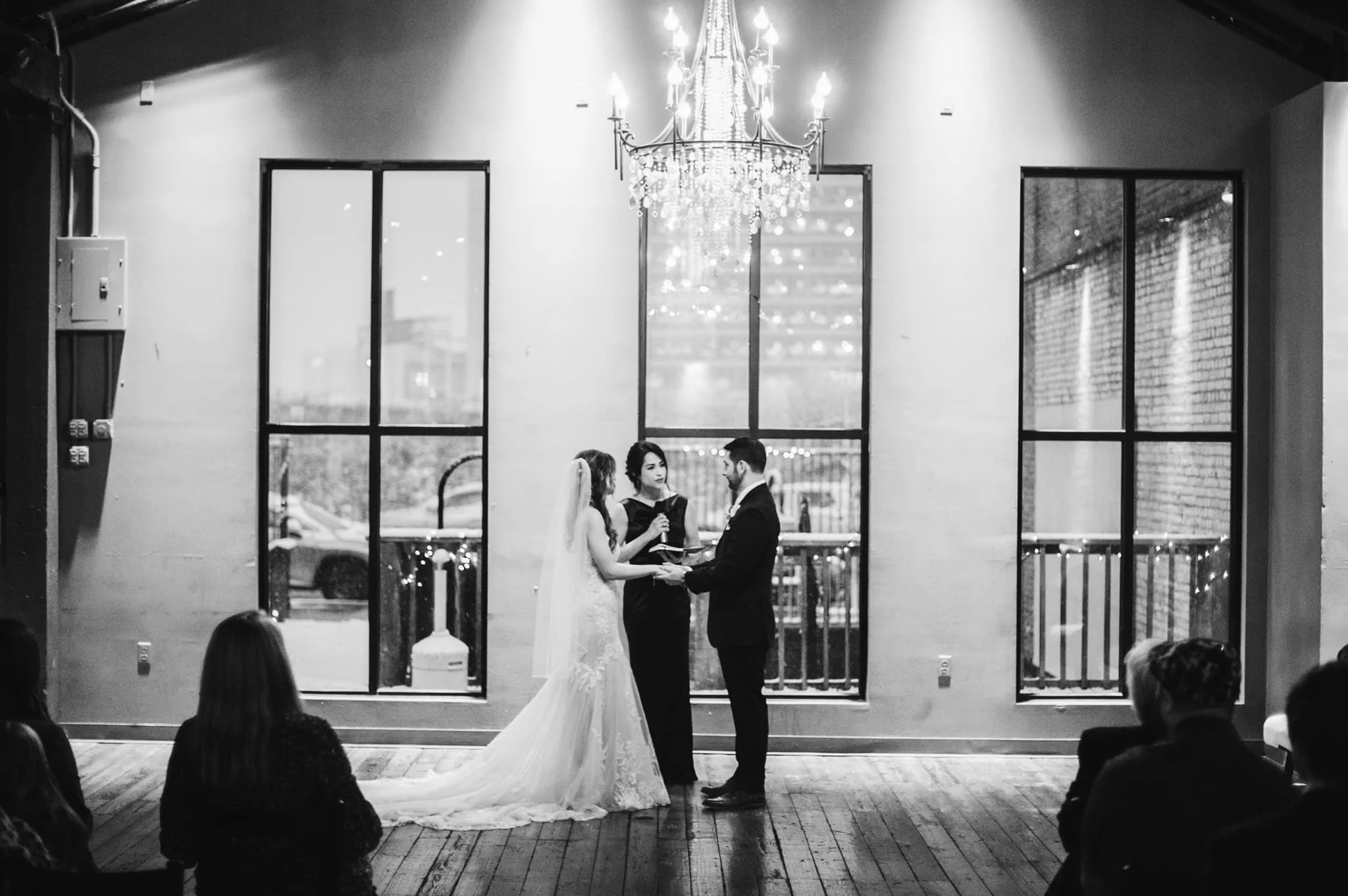 Wedding ceremony while snowing at Twenty Seven Event Venue in the River Market in downtown Little Rock Arkansas 