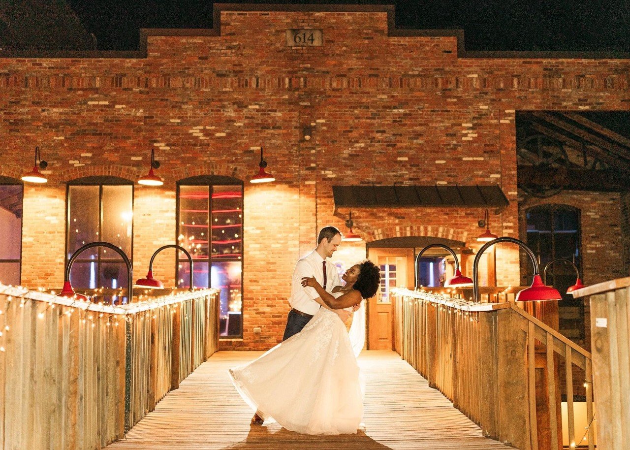 Wedding sendoff over entrance bridge at Twenty Seven venue in downtown Little Rock