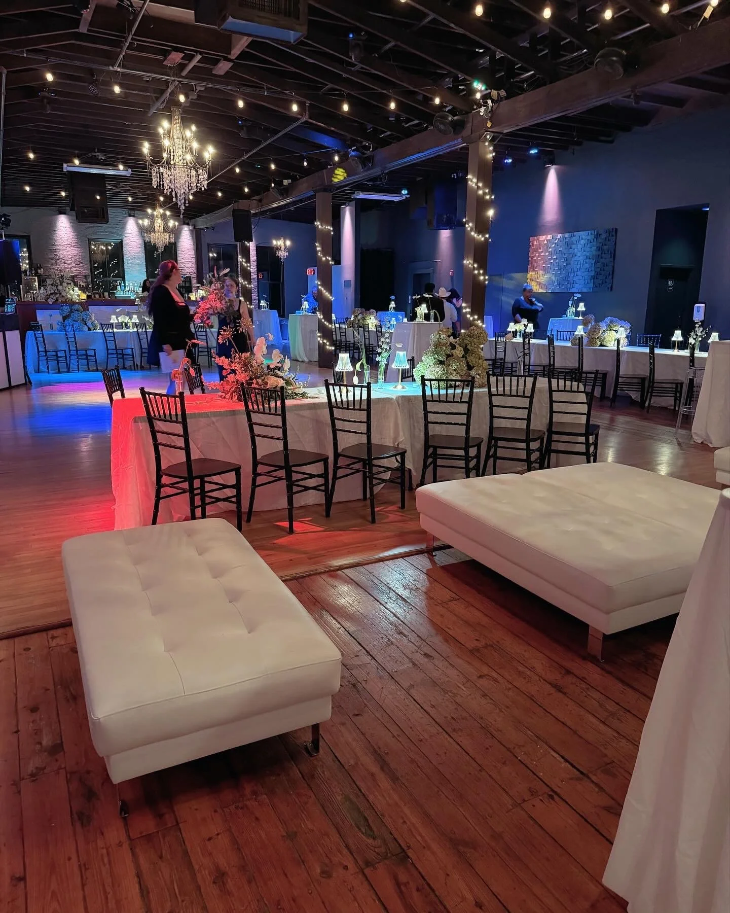 Wedding reception at Twenty Seven Event Venue in downtown Little Rock  with sophisticated white couches