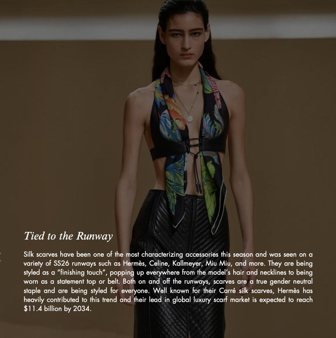 Fashion model wearing a colorful silk scarf styled as a halter top over a black leather outfit on a runway, with text about scarf trends.