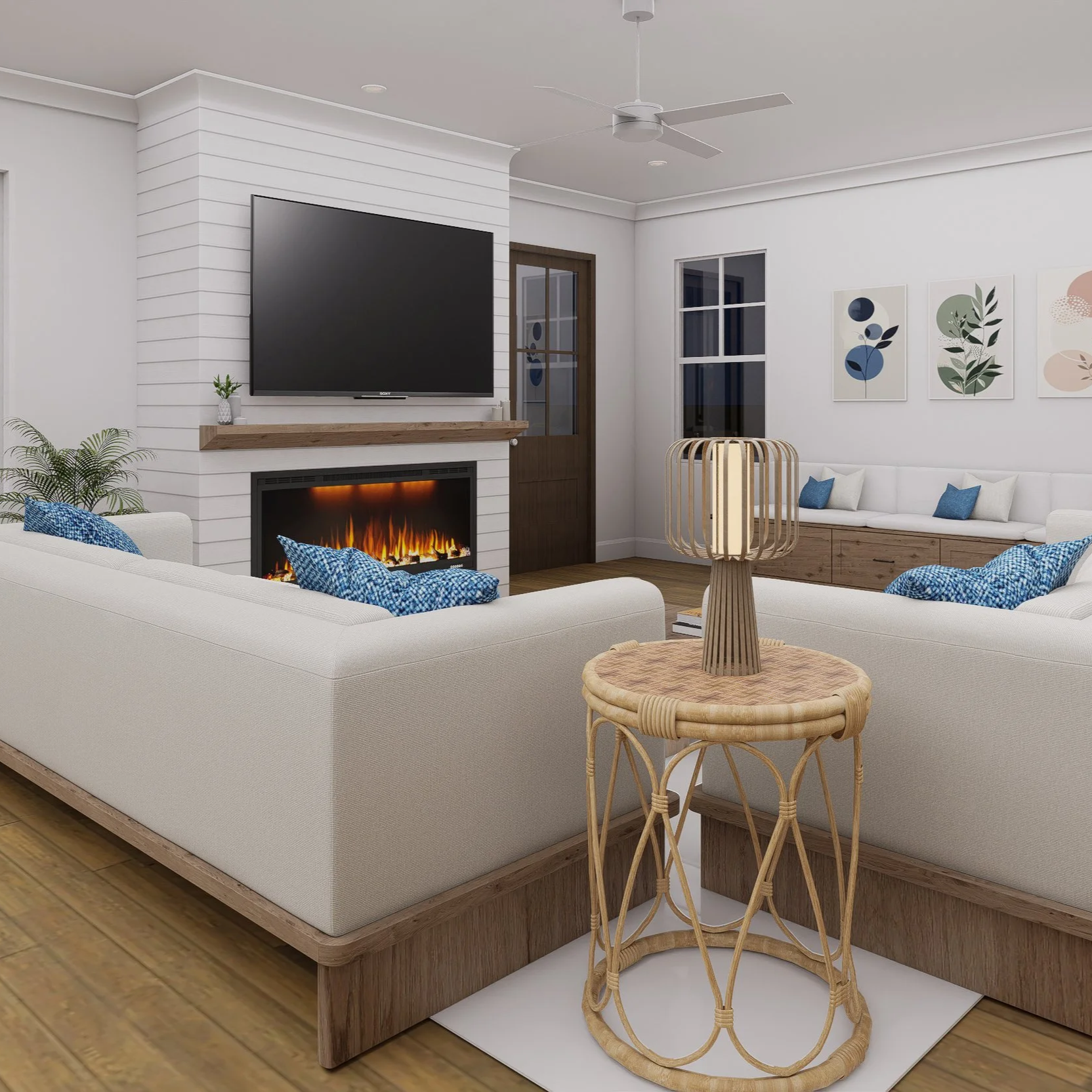 Living room with white sofas, a wooden coffee table, a wall-mounted TV above a fireplace, decorative wall art, and a ceiling fan.