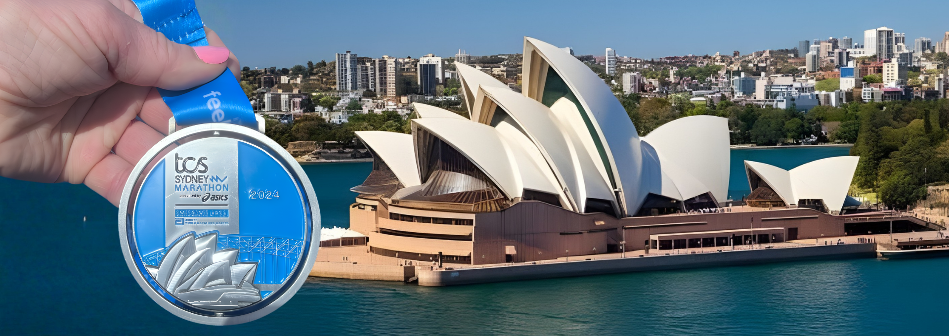 A person holding a silver medal for the 2024 Sydney Marathon in front of the Sydney Opera House with the Sydney city skyline in the background.
