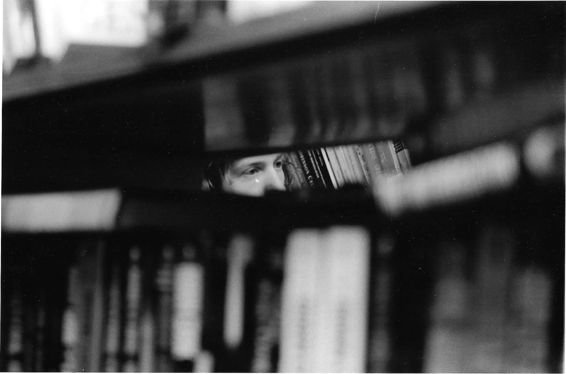 Scan of photo taken in a bookstore on 35mm black and white film and printed/edited in darkroom