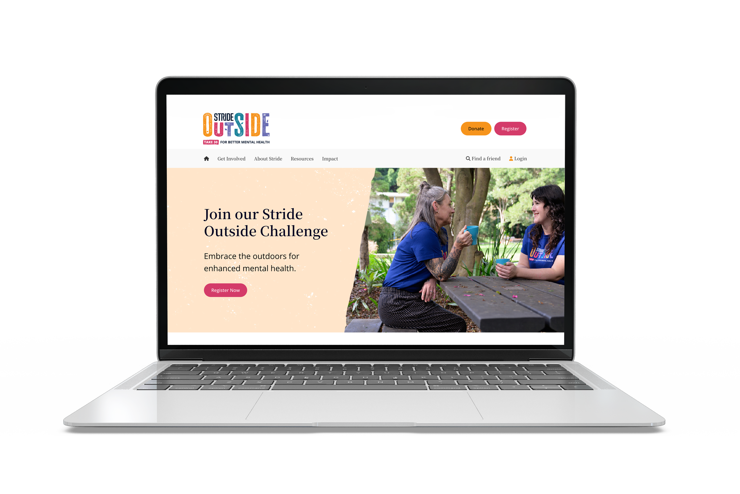 Laptop screen displaying a website for the Stride Outside Challenge, featuring a photo of two women sitting outdoors at a park table, engaging in conversation, with the website's invitation to join the challenge for better mental health.