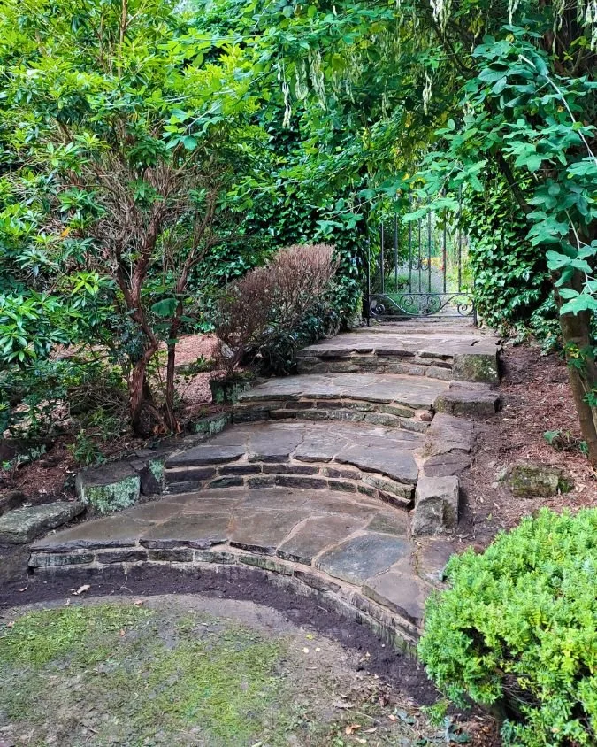 Curved garden steps leading through planted borders, wylam, northumberland, mortared stone