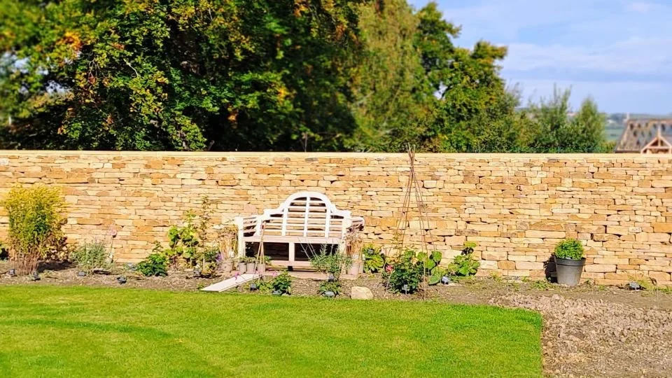 Ornamental dry stone garden wall, Dilston, Northumberland, residential