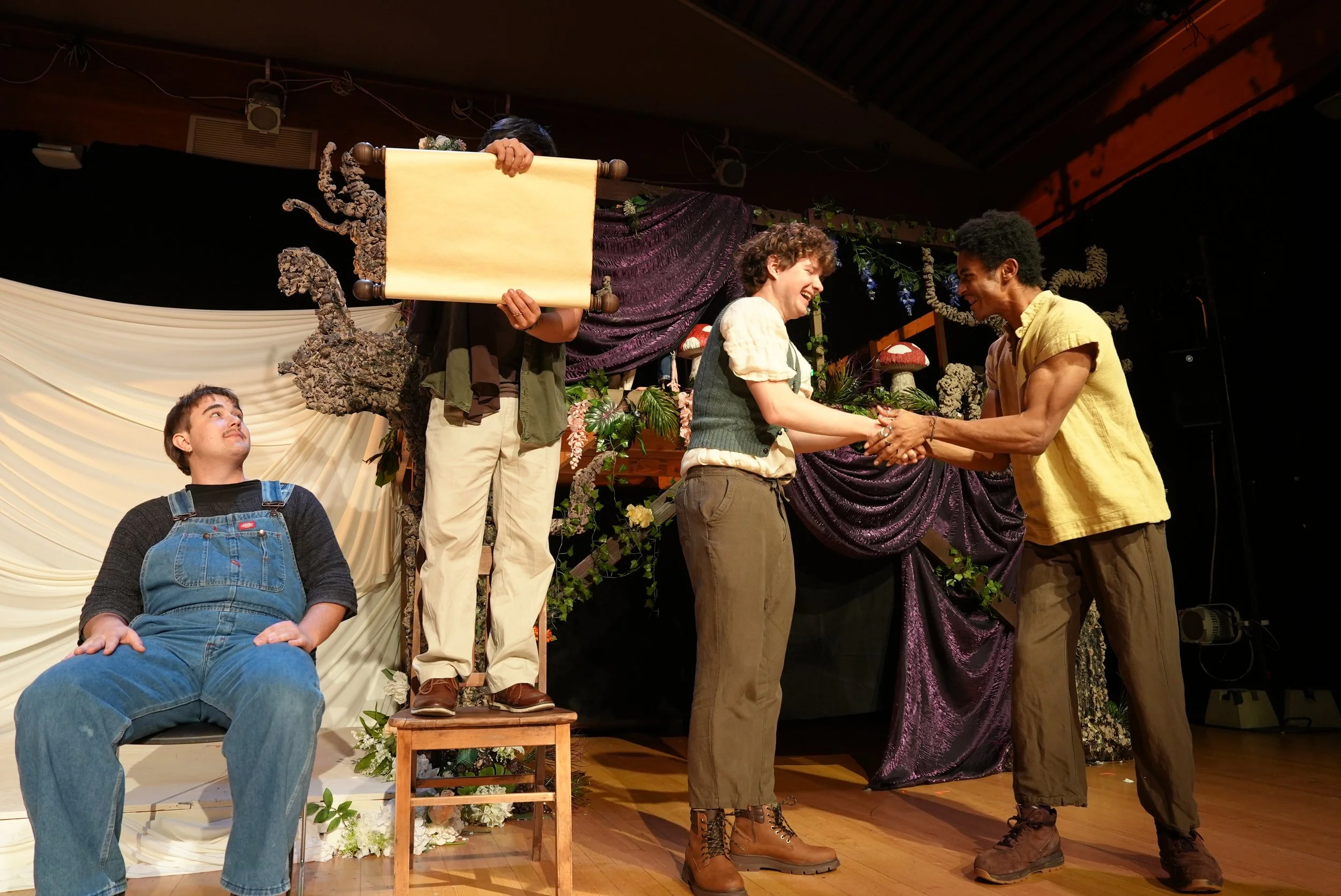Owen Rowe as Nick Bottom, Kai Teigen as Peter Quince, Thomas Raith as Starveling, and Iyanu Olukotun as Francis Flute performing in A Midsummer Night’s Dream, photographed by Haein Shim