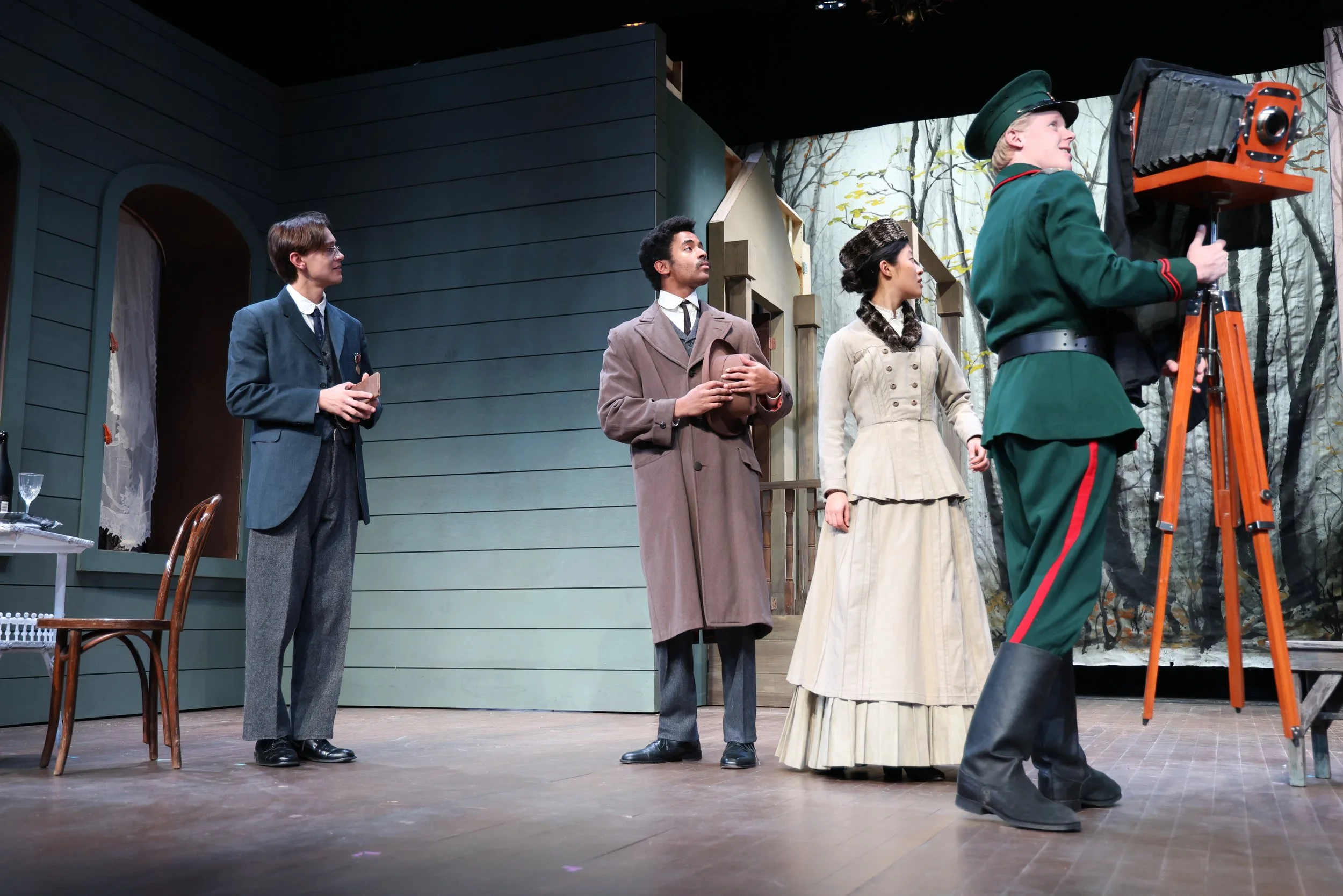 Iyanu Olukotun as Tuzenbach in an ensemble scene with Kulygin, Irina, and Fedotik in Three Sisters, photographed by Stephanie Okuda
