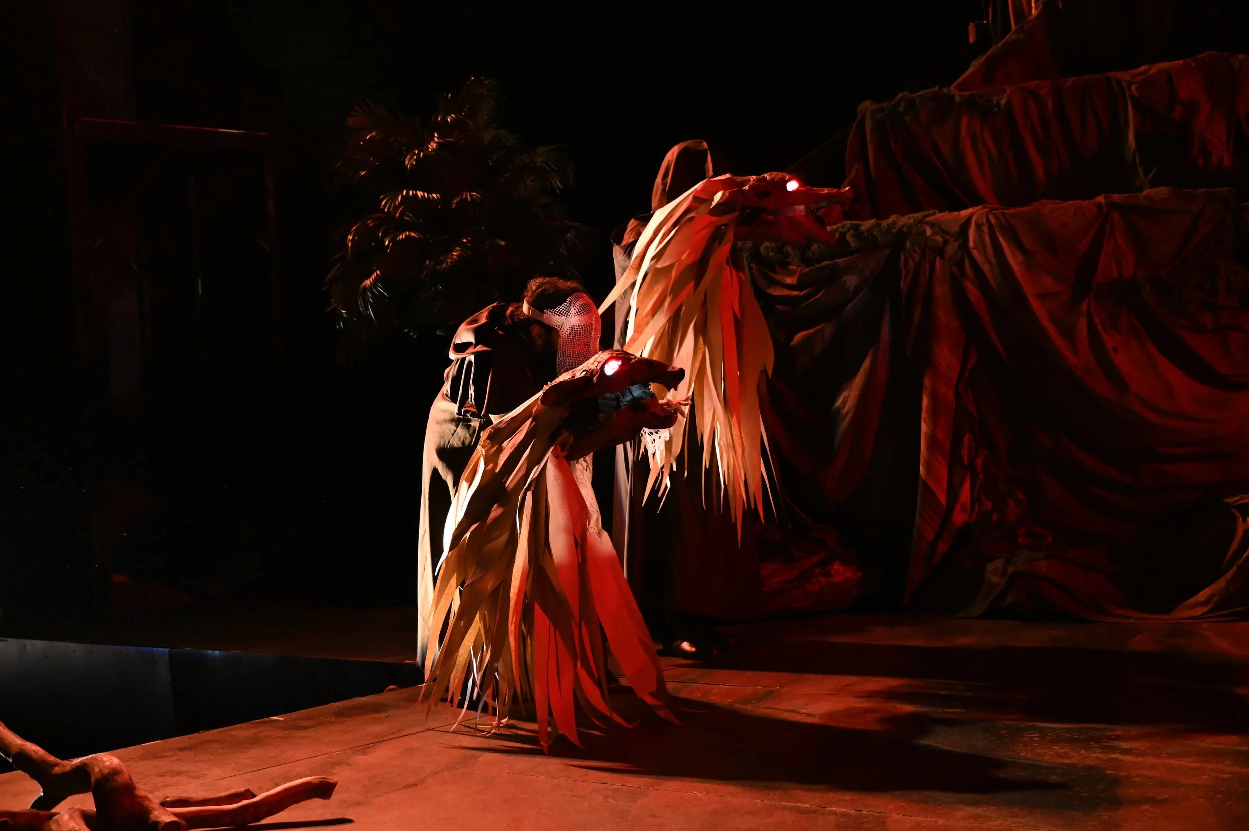Iyanu Olukotun performing as the Hound Spirit puppeteer in a duo movement sequence in The Tempest at Marin Shakespeare Company, photographed by Jay Yamada