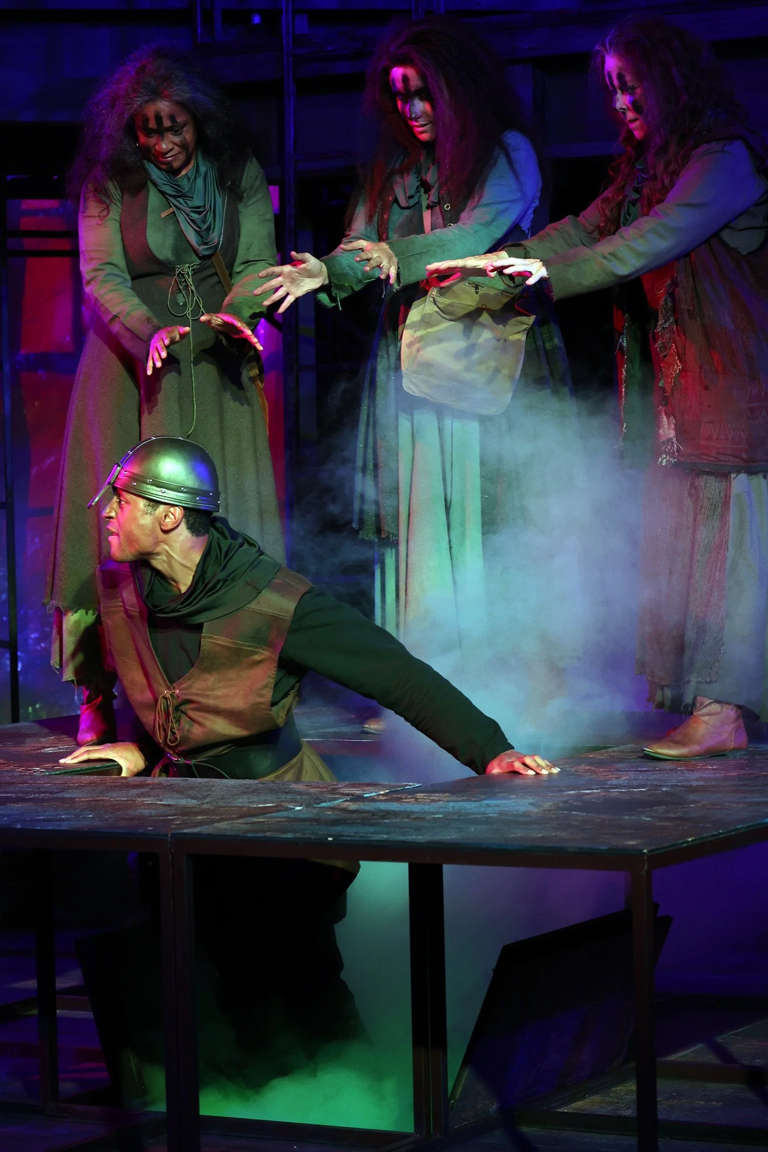 Carolyn Ratteray as Witch 2, Renée Torchio MacDonald as Witch 3, and Patty Gallagher as Witch 1 with Iyanu Olukotun as Second Apparition in Macbeth, photographed by Kevin Lohman
