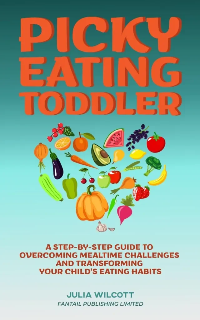 Book cover titled "Picky Eating Toddler" with illustrations of various fruits and vegetables forming a heart shape. Subtitle explains it's a guide to overcoming mealtime challenges and improving child's eating habits. Author Julia Wilcott, Fantail Publishing Limited.