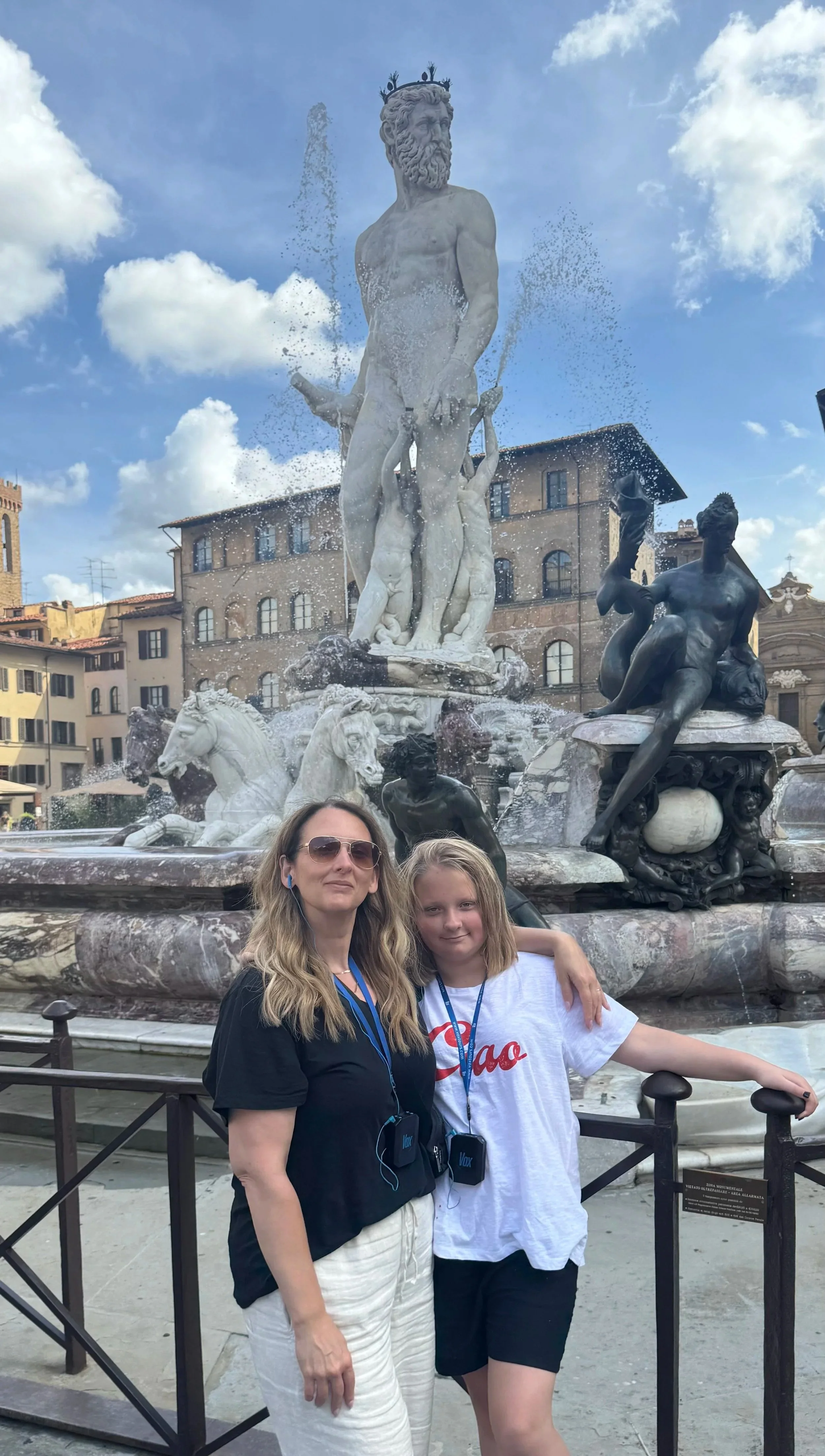 mother and daughter in front of fountain in Italy