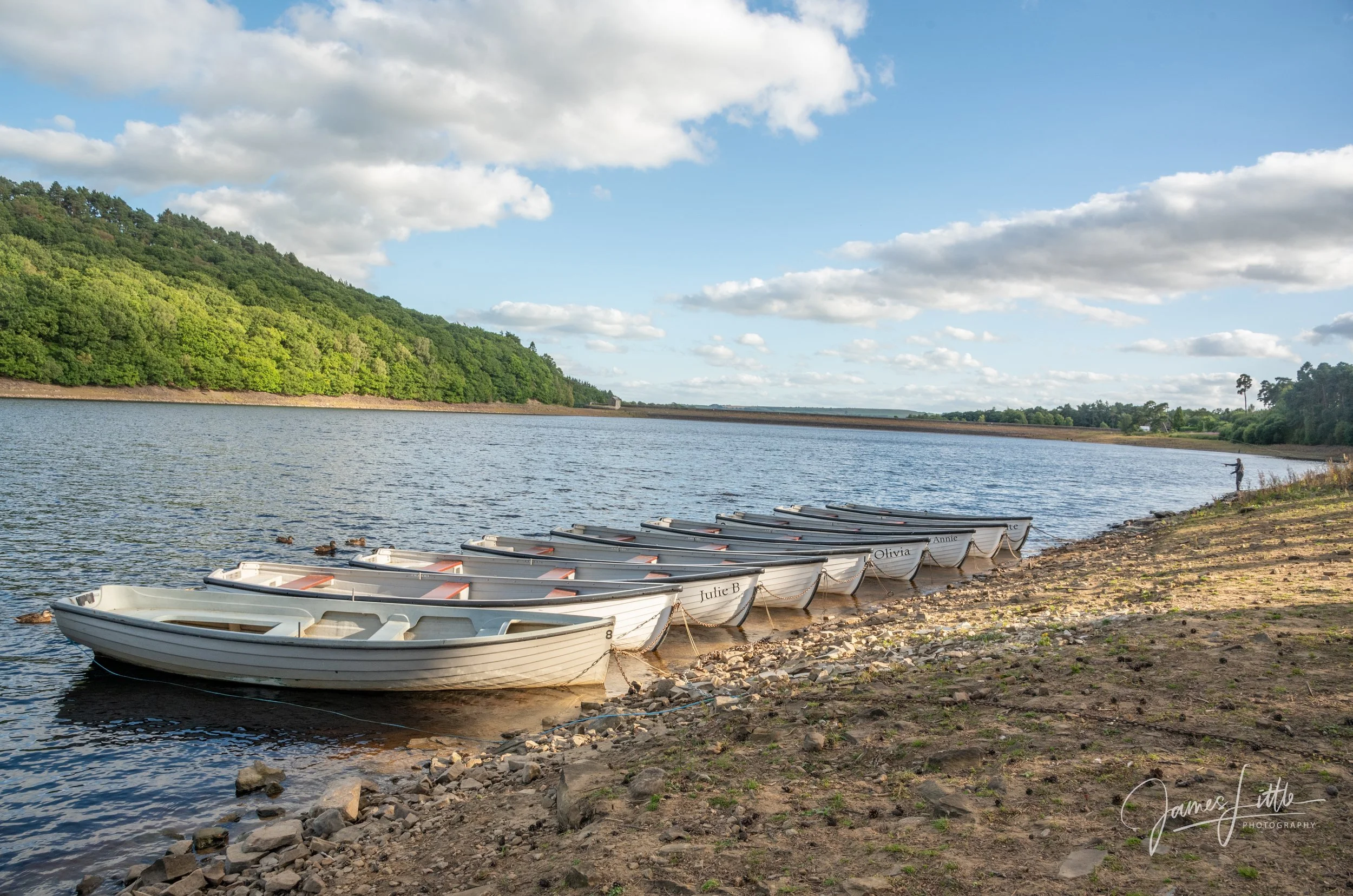 Tunstall Reservoir with some fishing boats ready for a spot of fishing
