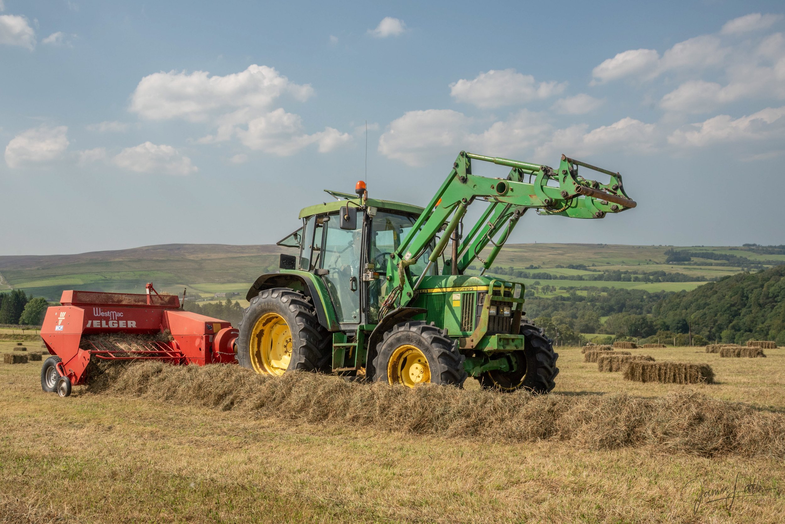 Robert Philipson of Broadgate farm sinderhope during a summer collecting the square bales