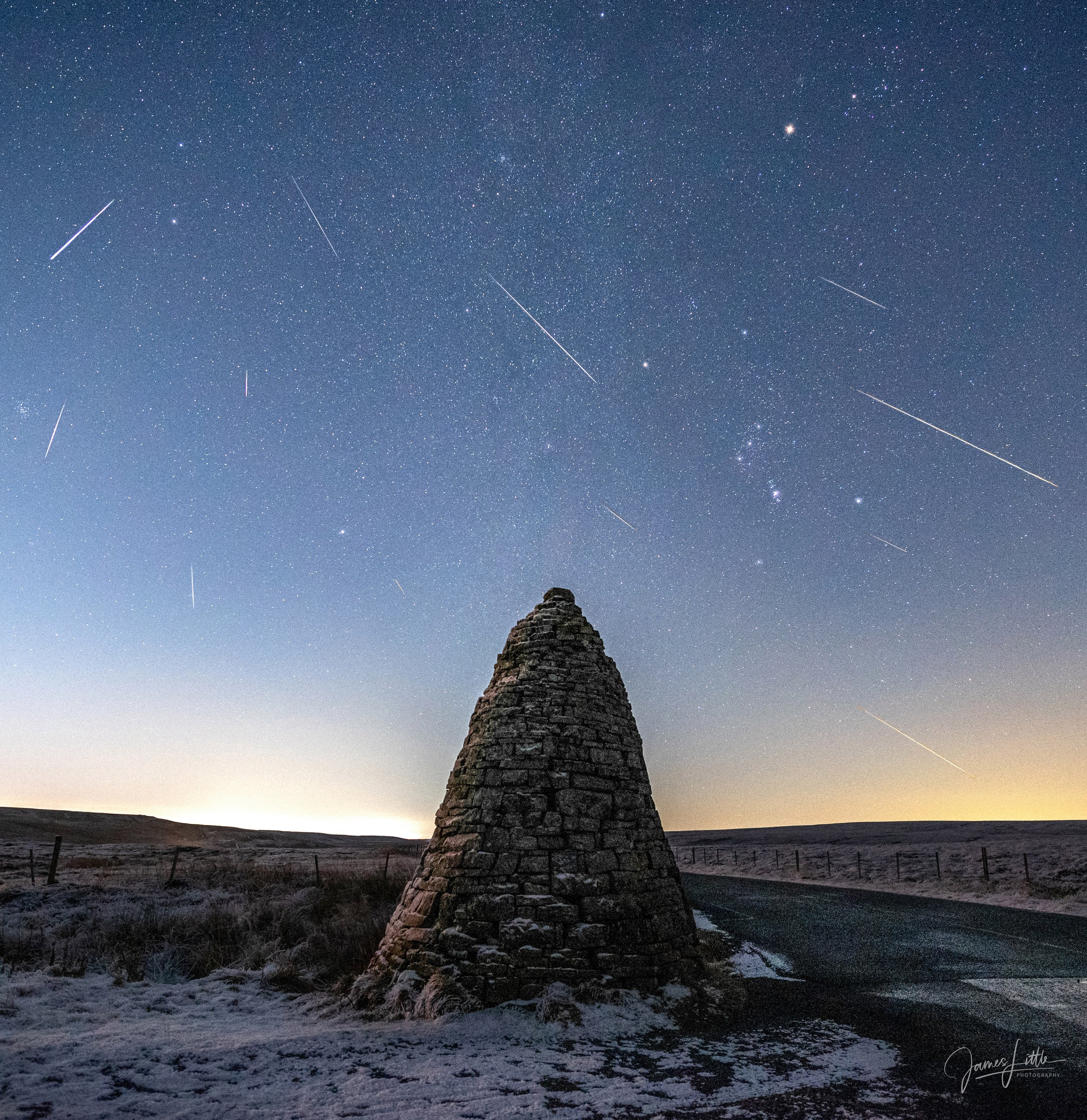 Geminids meteor shower over the stone cairn at Allenheads
