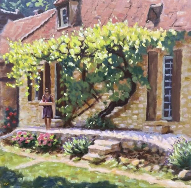 A painting of a stone house with a woman standing on the porch, green bushes, and colorful flowers in the garden.