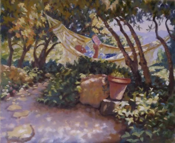 A person lying in a hammock in a garden surrounded by trees, potted plants, and rocks, reading a book.