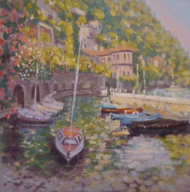 Painting of boats docked along a river with colorful buildings and lush green trees in the background.