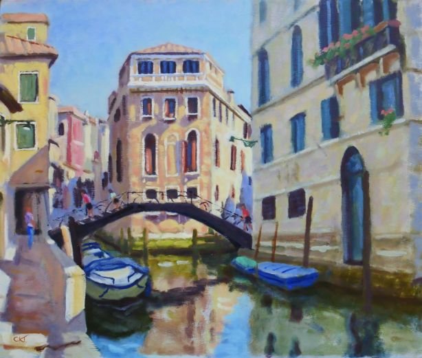 A watercolor painting of a canal scene in Venice with boats docked along the water, a small arched bridge, and historic buildings with colorful facades and balconies.