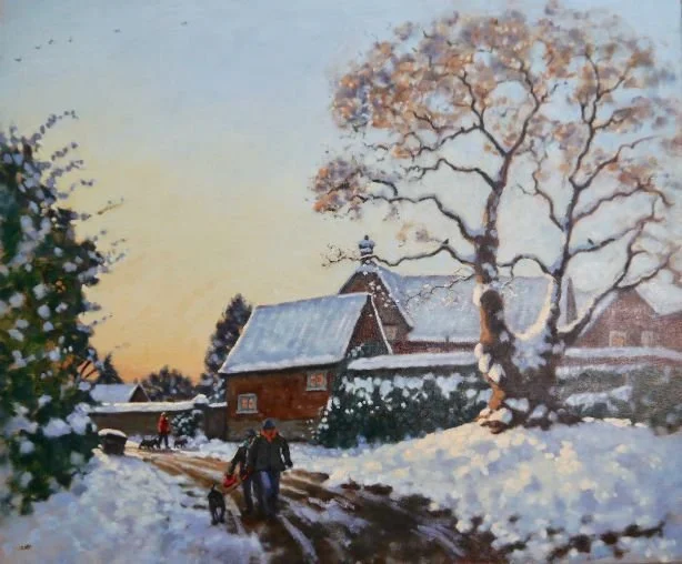 A winter scene with snow-covered ground and trees, a house in the background, and a person walking a dog along a muddy path at sunset.