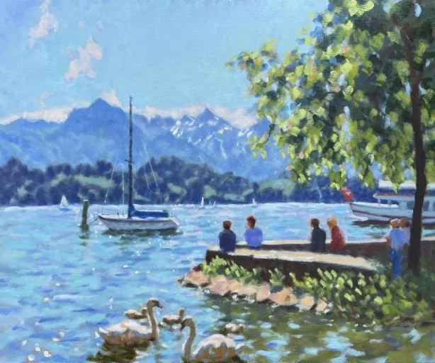 Painting of a lakeside scene with sailboats on the water, a group of people sitting on a stone wall, and ducks swimming near the shore, with mountains and trees in the background.