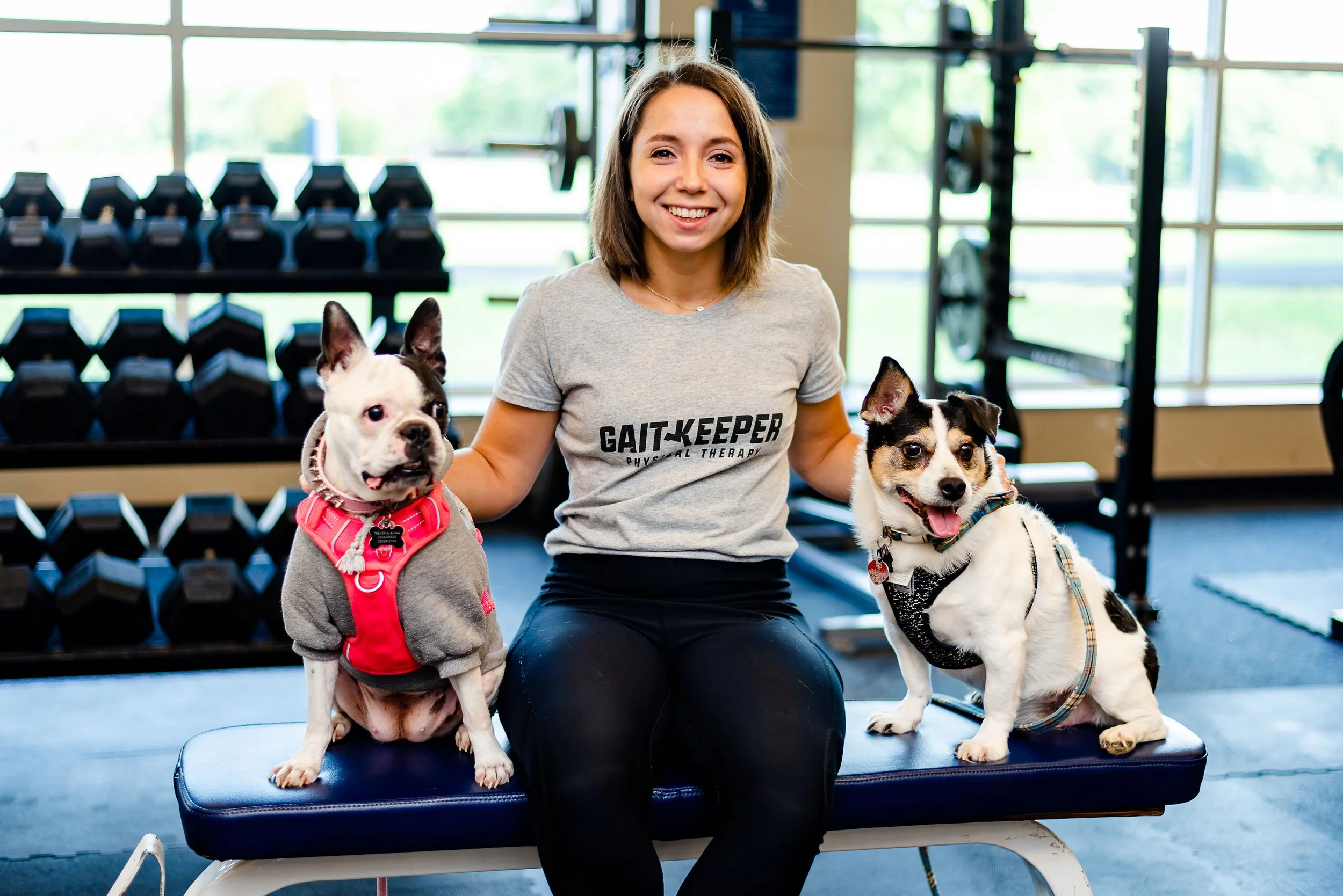Alina with her two dogs at Gait Keeper Physical Therapy