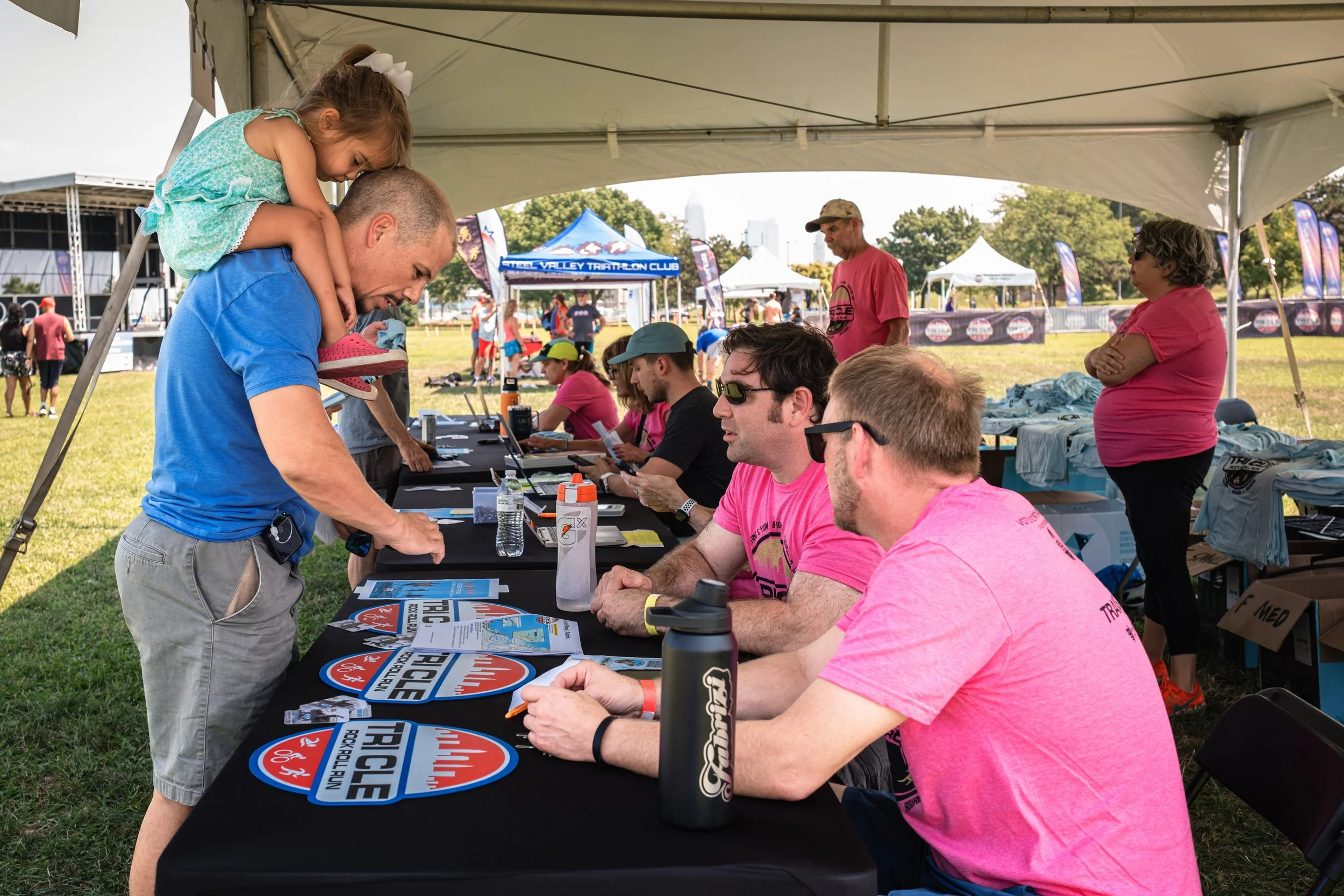 participants checking in at Tri CLE with volunteers