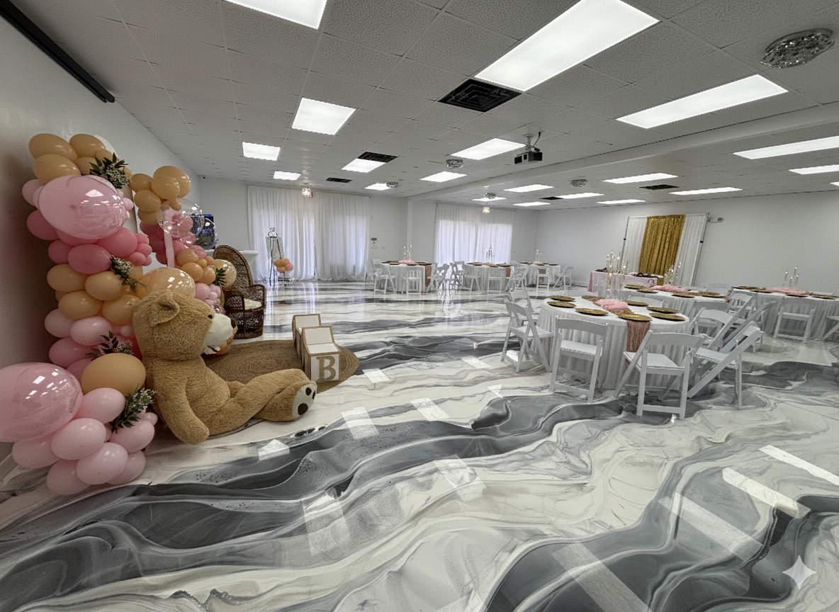 Decorated event space with balloons, teddy bear, and tables set for a celebration.