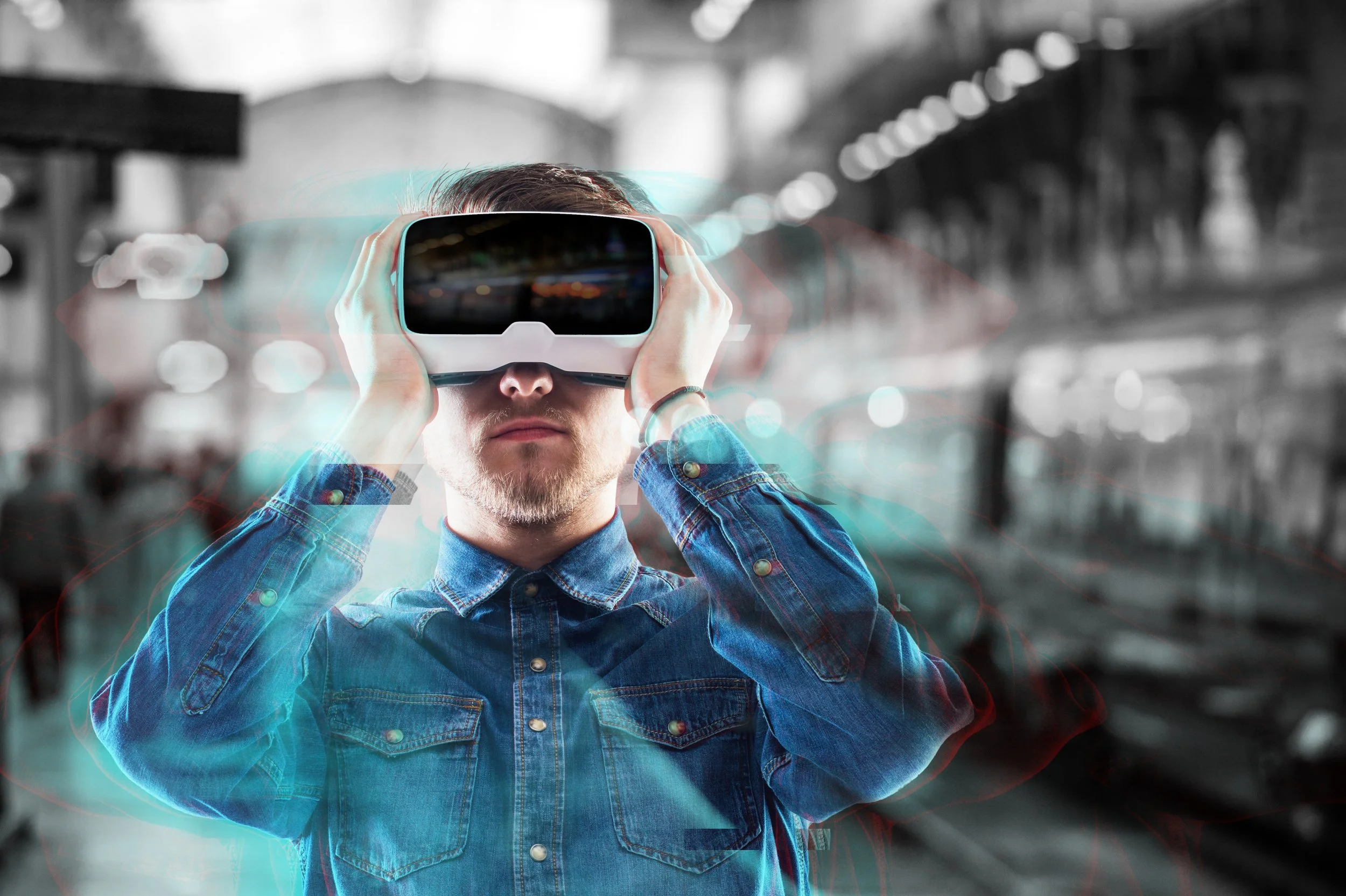 hipster-man-in-denim-shirt-wearing-virtual-reality-goggles-standing-on-subway-station-SBI-305198107.jpg