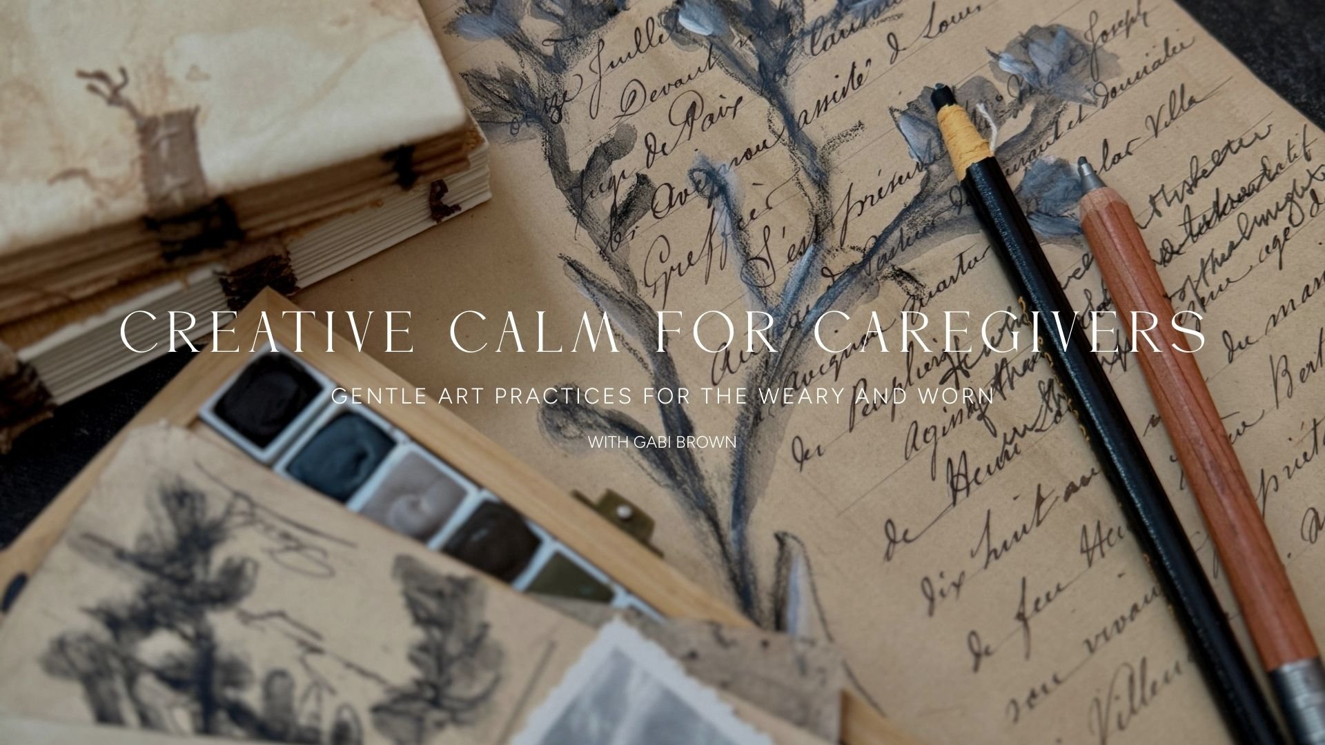 Stationery with handwritten notes, watercolor paint set, and two pens on a vintage paper background