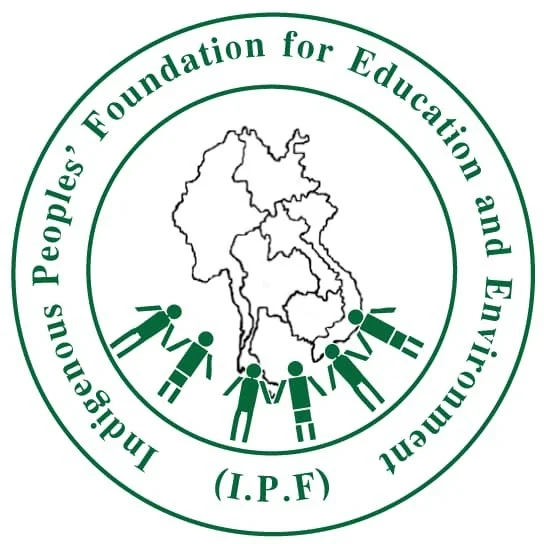 Logo of the Indigenous Peoples' Foundation for Education and Environment (I.P.F) with a map outline of India, five stylized figures holding hands in front of the map, and green text encircling the design.