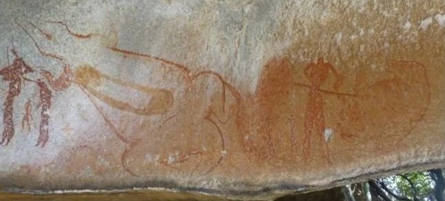 large depiction of a crocodile and human figures