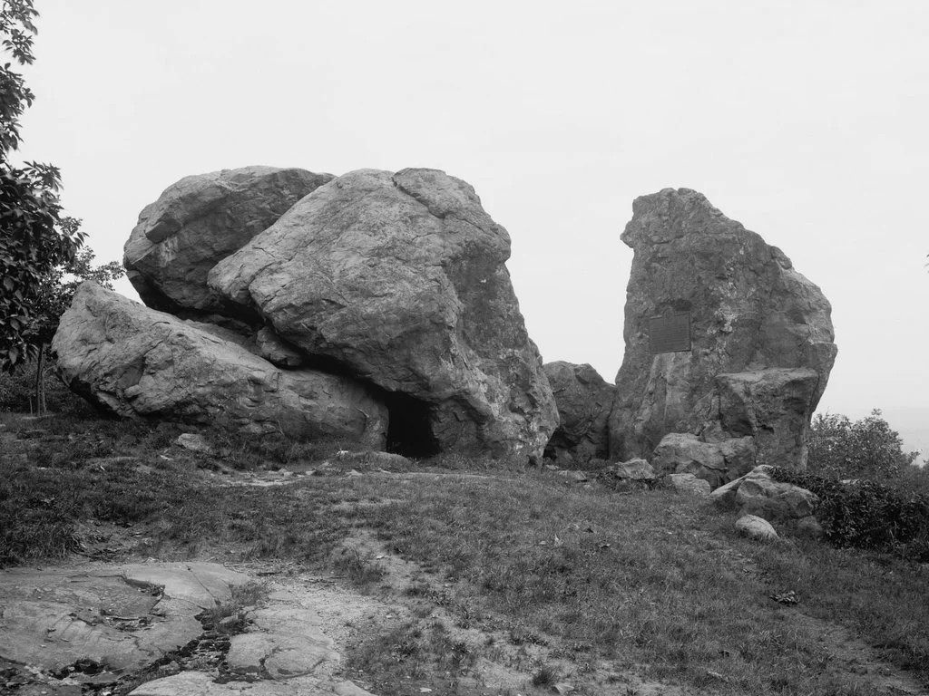 This striking modern photo captures Judges Cave&mdash;a dramatic pile of massive glacial boulders forming a natural rock shelter high atop West Rock Ridge in what is now West Rock Ridge State Park, New Haven, Connecticut. With its shadowy overhangs, 