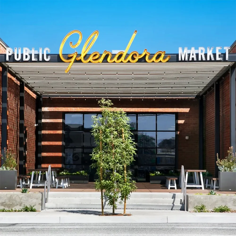 Exterior of Glendora Public Market during a bright sunny day.
