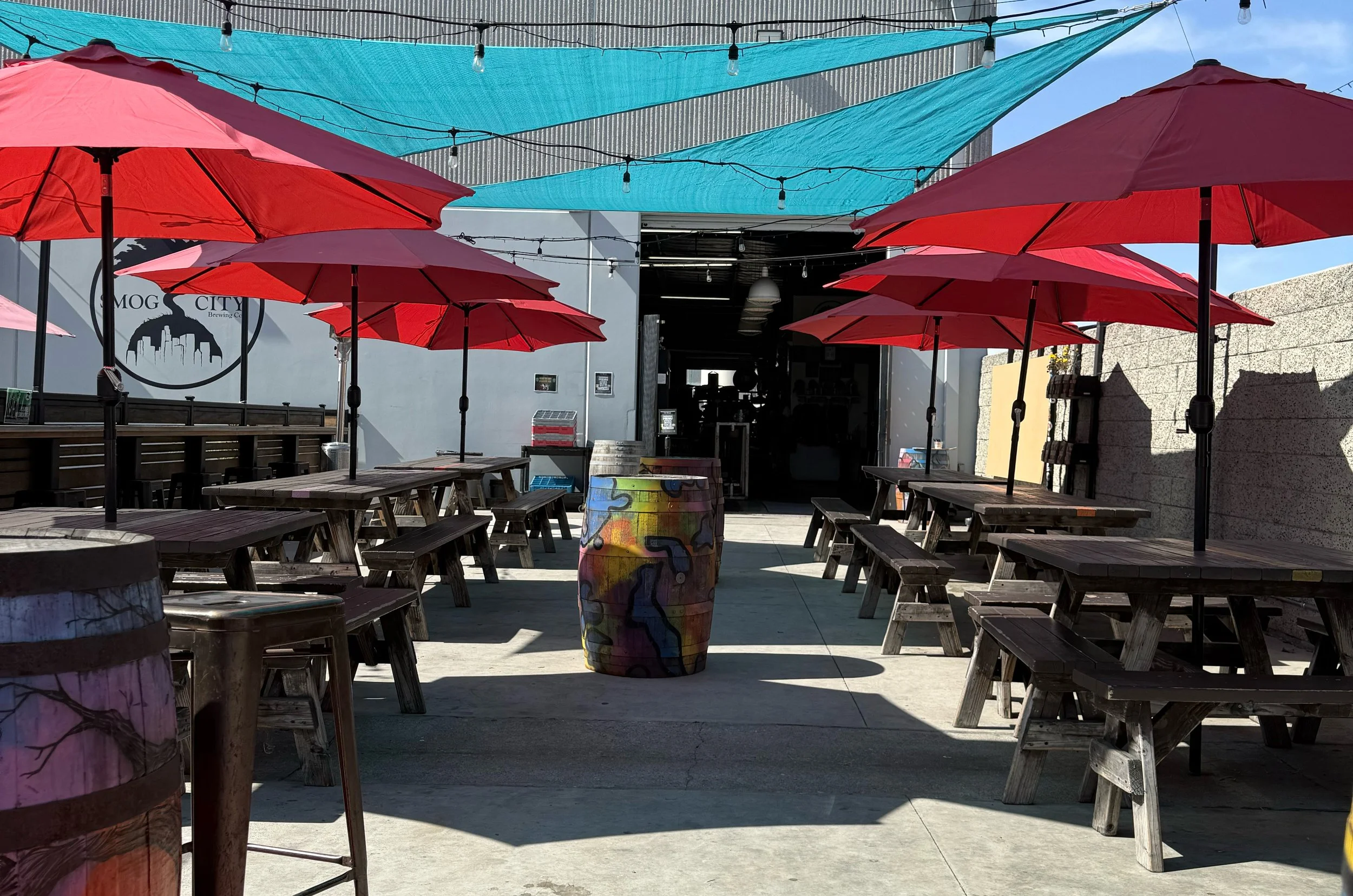 View of outdoor patio outside entrance of Smog City Brewery.