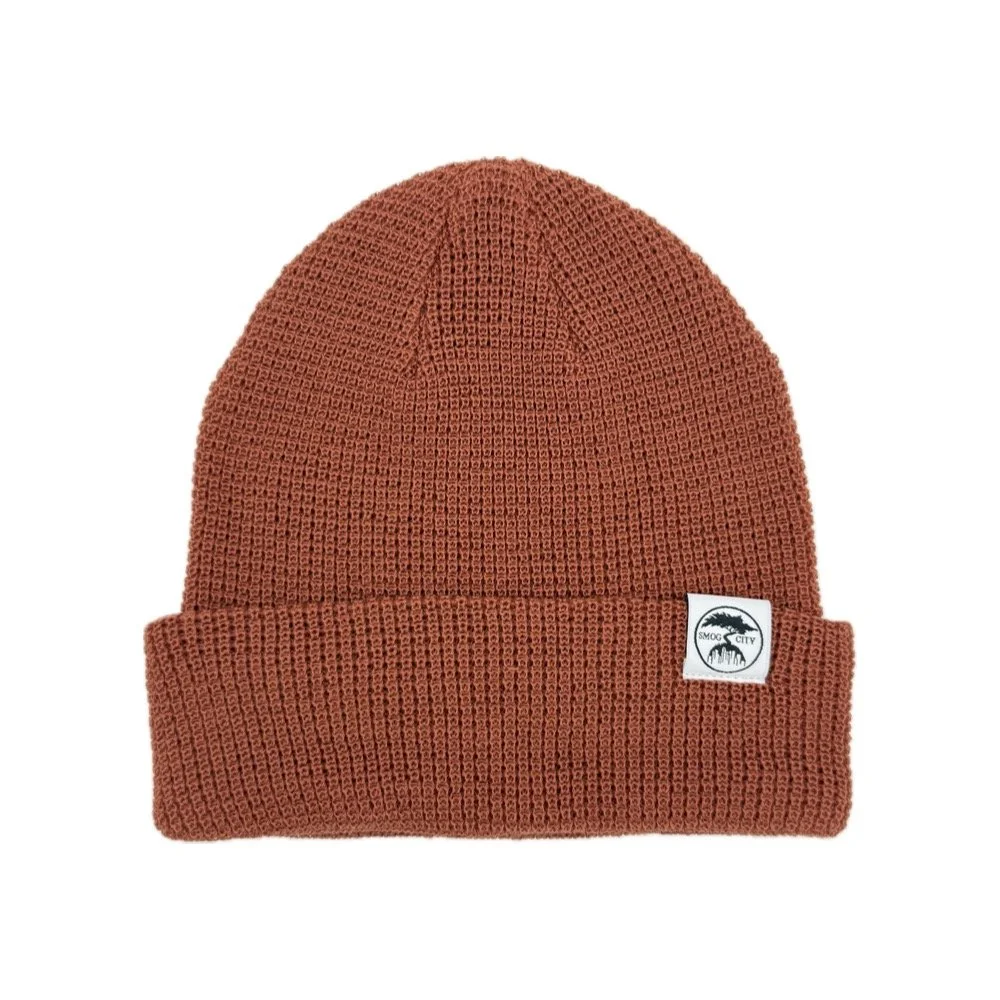 Rust waffle knit beanie with Smog City logo, recycled polyester, cuffed style Front.jpg
